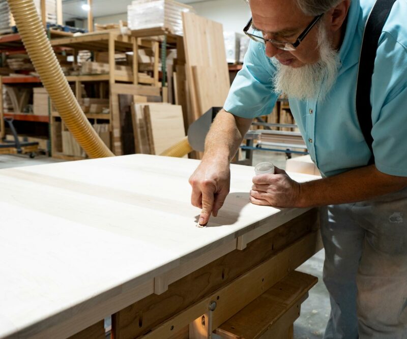 Amish Craftsman Working in Woodshop