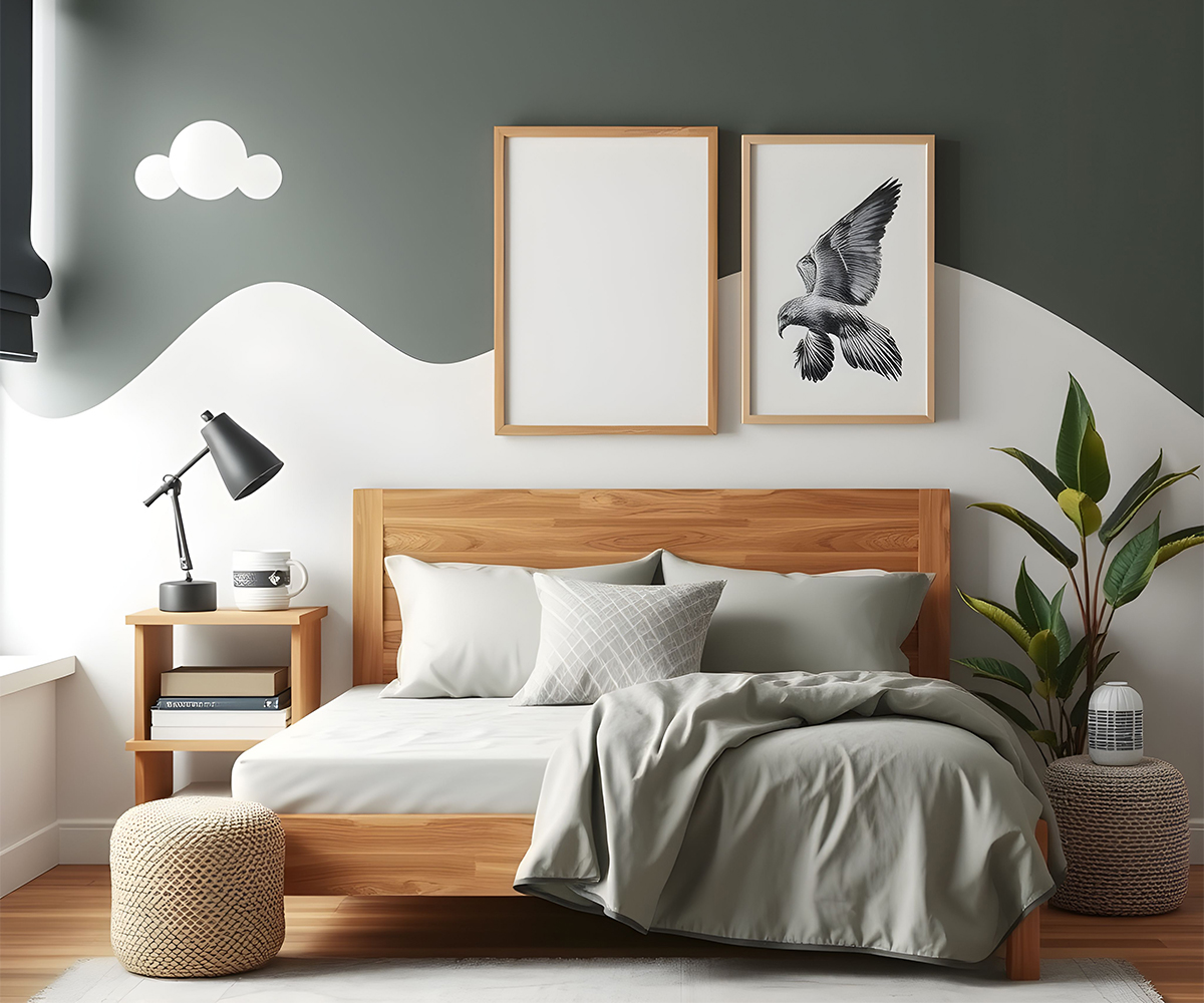 Solid wood bed with gray bedding in a modern bedroom with nightstand and plant.